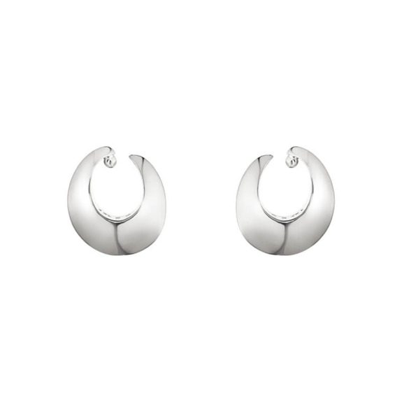 Silver crescent-shaped hoop earrings on white background.