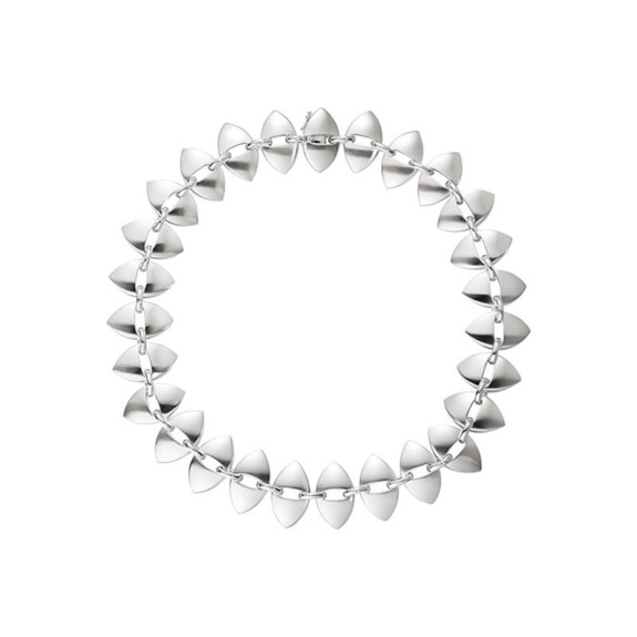 Silver geometric necklace with triangular links arranged in a circular design on a white background.