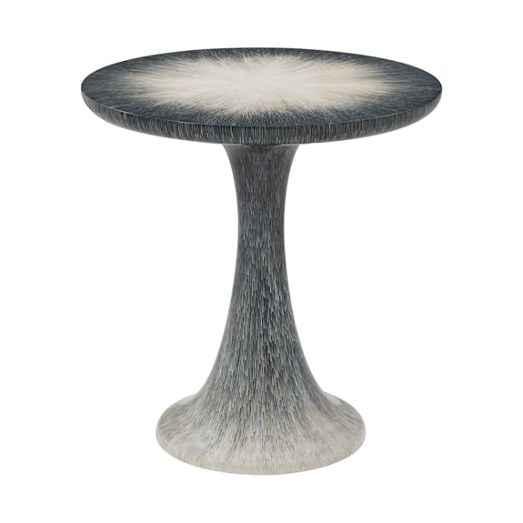 Unique artistic pedestal table with a textured, curved base and smooth, round top in shades of grey and white.