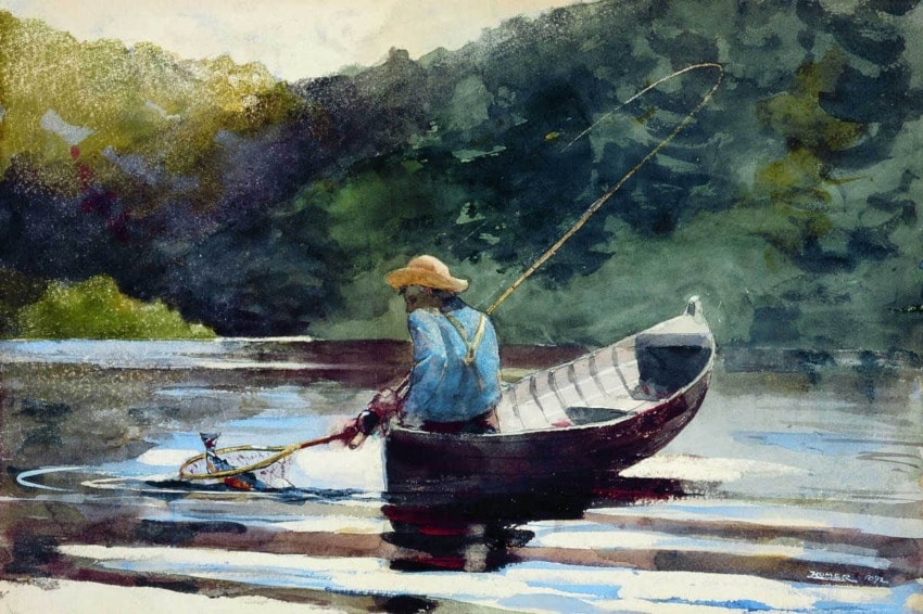 Person in a wide-brimmed hat fishing from a small boat on a calm river surrounded by lush green foliage.