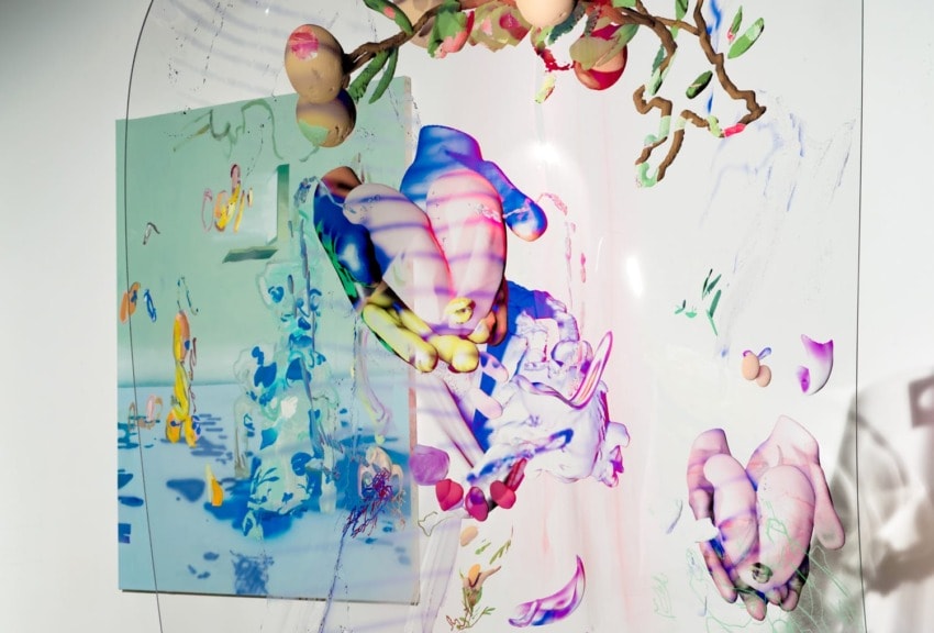 Abstract colorful 3D shapes and reflections on a translucent surface with floating branches and egg-like objects.