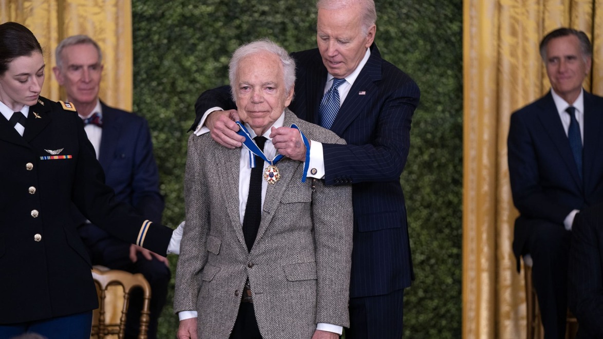 Ralph Lauren receiving the Presidential Medal of Freedom from President Biden.
