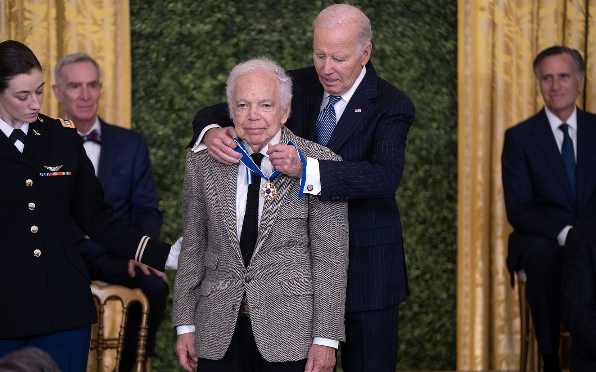 Ralph Lauren receiving the Presidential Medal of Freedom from President Biden.