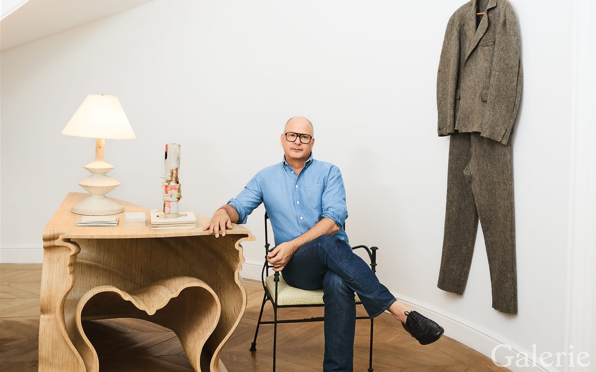In his New Canaan, Connecticut, home, Reed Krakoff displays Felt Suit (1970) by Joseph Beuys along with a table by Jeroen Verhoeven and a chair by Diego Giacometti.