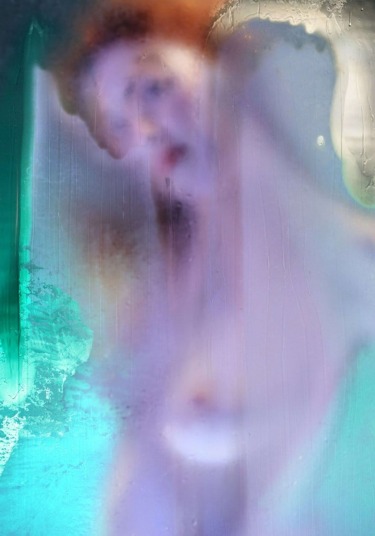 Abstract art with blurred colors and shapes, featuring a mix of blue, purple, and green tones creating a dreamy effect.