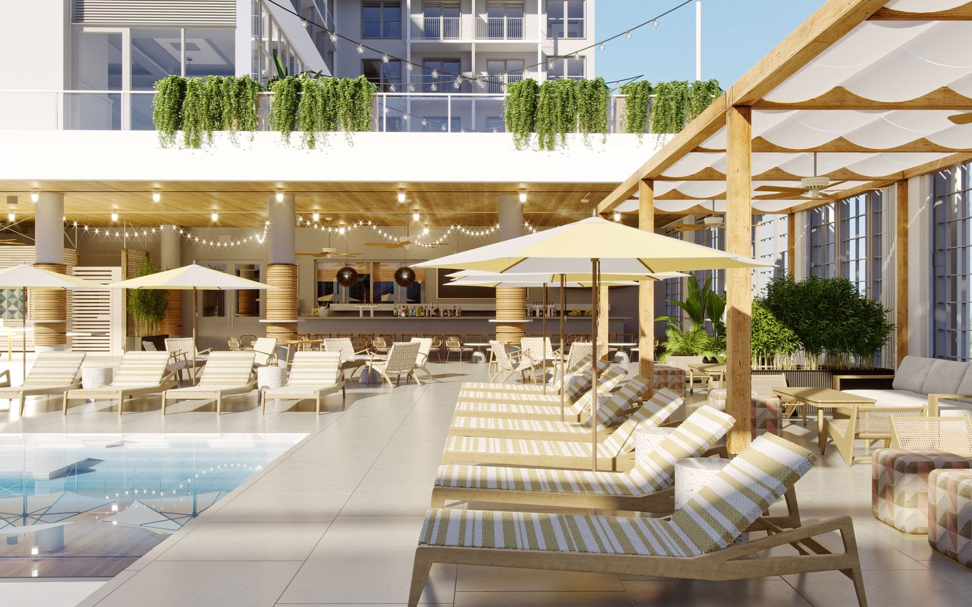 Luxurious poolside area with sun loungers, umbrellas, greenery, and modern architecture under a clear blue sky.