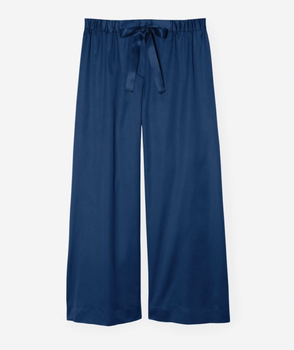 Blue wide-leg satin pants with an elastic waistband and a matching tie belt.