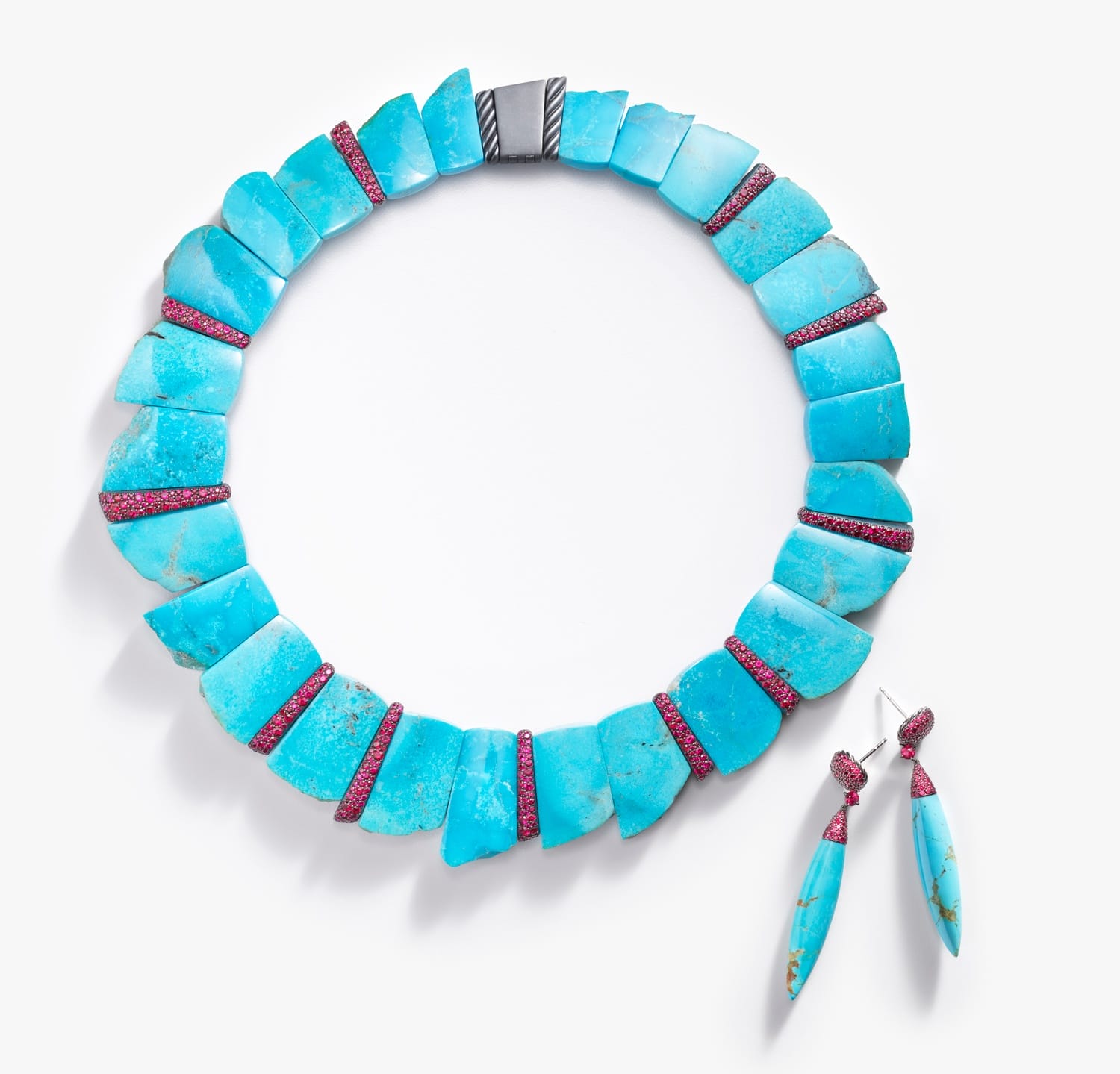 Turquoise and magenta gemstone necklace with matching earrings displayed on a white background.