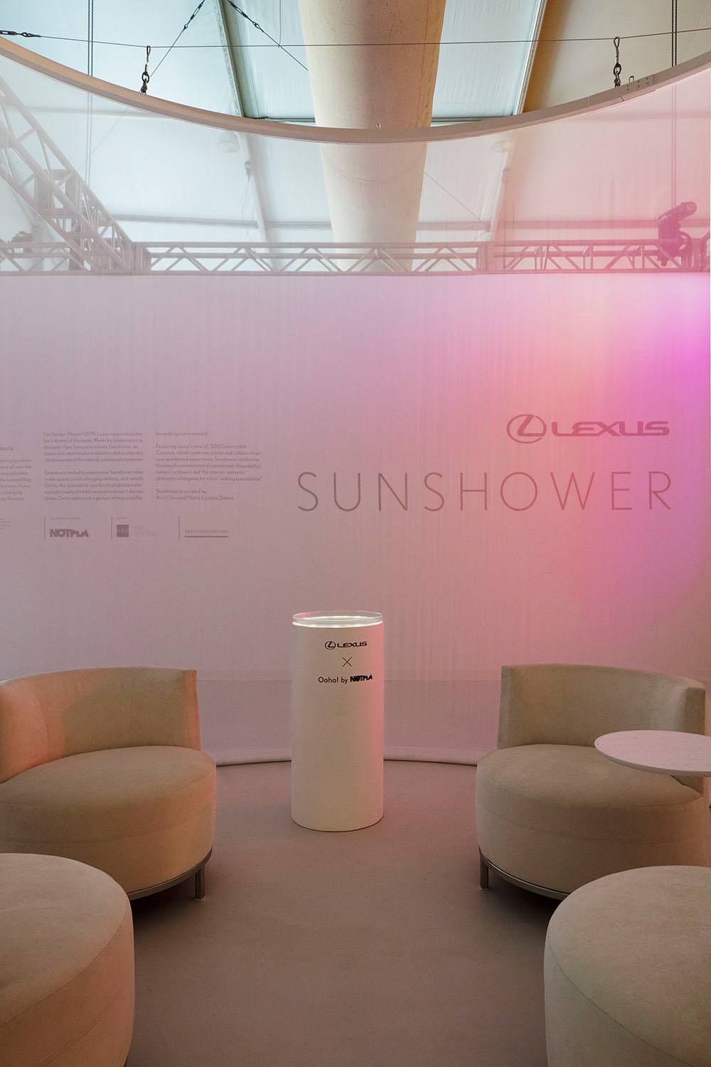 Lexus Sunshower display with comfortable seating and ambient lighting at a modern exhibition space.