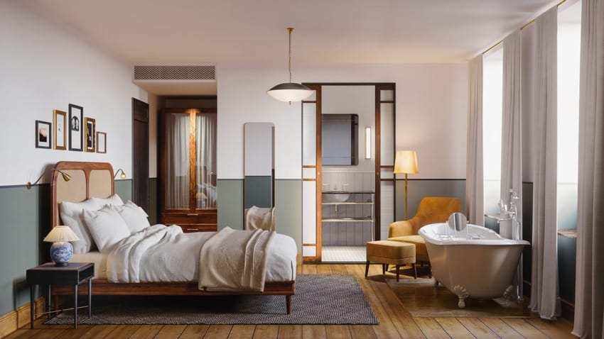 Cozy bedroom with a vintage bathtub, elegant furnishings, wooden bed, soft lighting, and framed pictures on the wall.