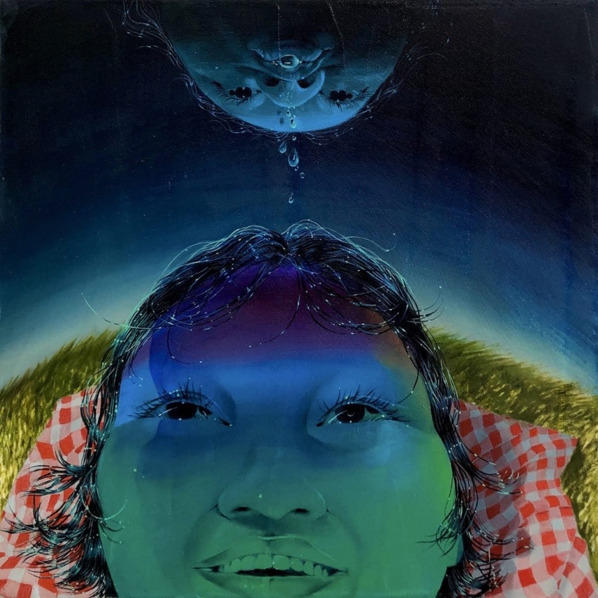 Surreal painting of a person lying on grass, face painted in vivid colors, with another face and water droplet above.