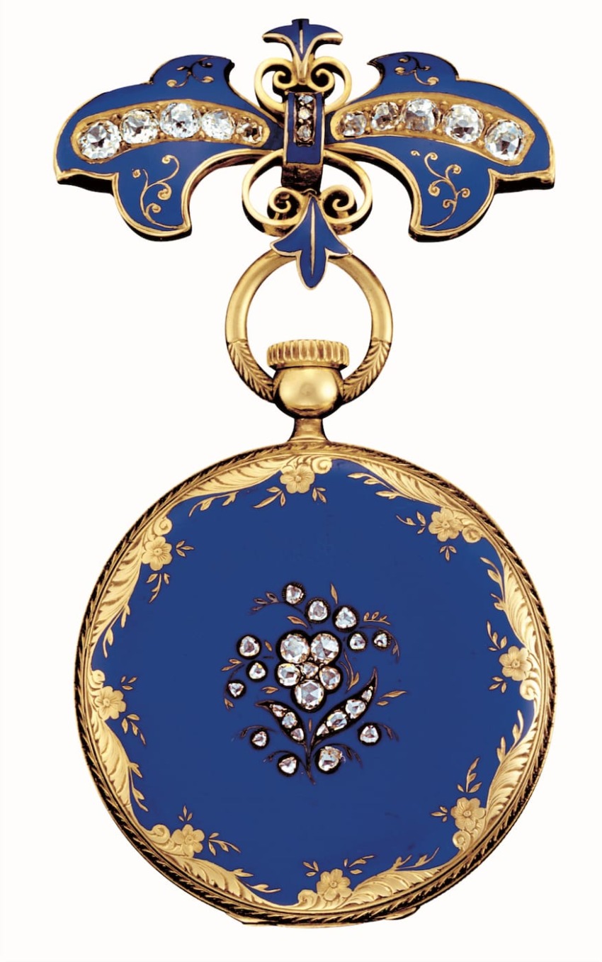 Blue and gold antique pocket watch adorned with intricate floral and butterfly patterns, embellished with sparkling gems.