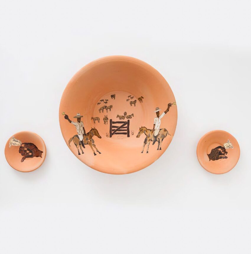 Three ceramic bowls with cowboy and horse illustrations on a white background.