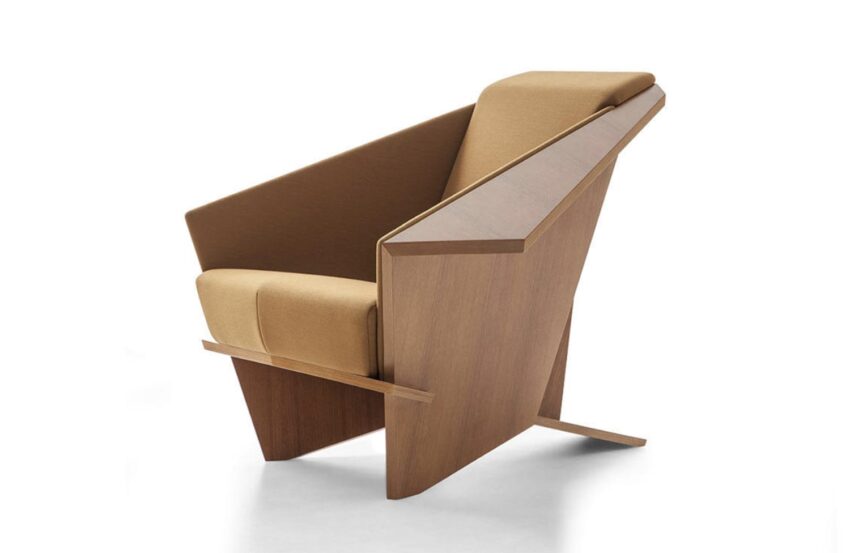 Modern wooden armchair with tan cushions and angular design.