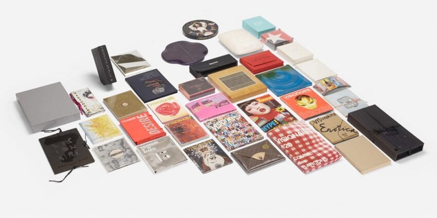 A collection of colorful, assorted book covers and packaging arranged neatly on a white background.