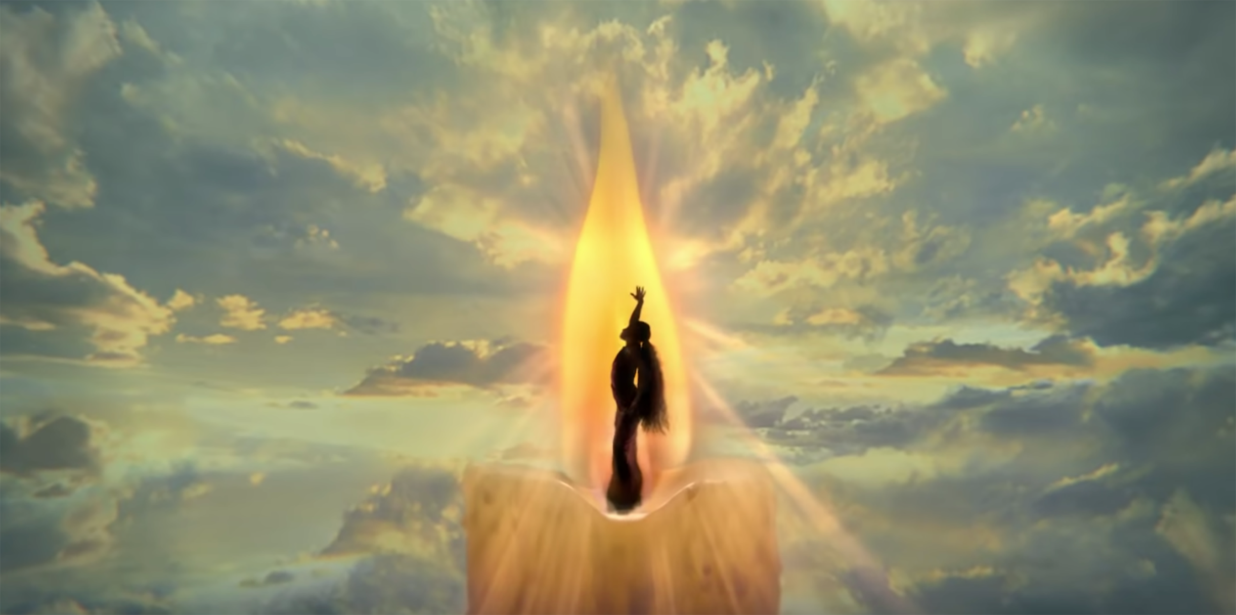 Silhouette of a person reaching upward in a glowing light against a dramatic sky background.