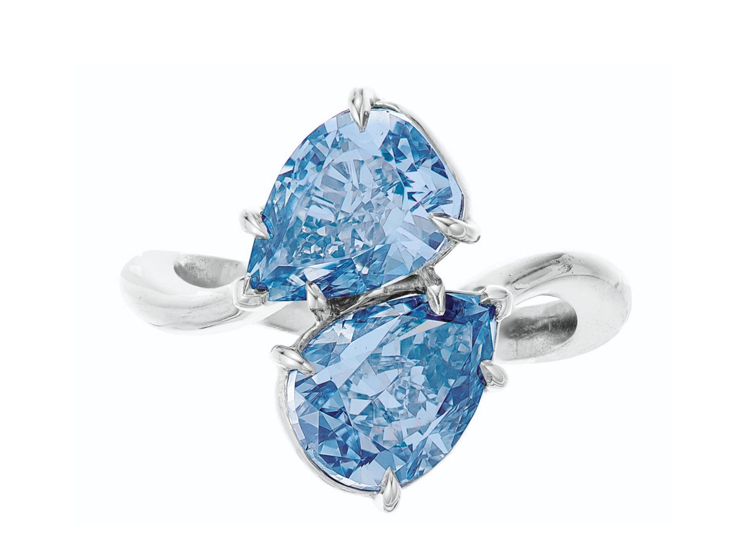Silver ring with two pear-shaped blue gemstones on a wrap-around band against a white background.
