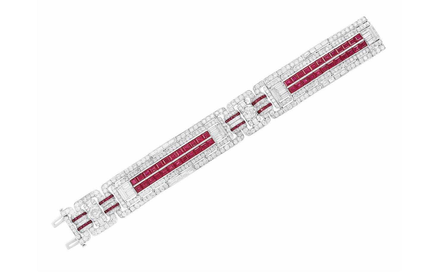 Art Deco diamond and ruby bracelet with geometric patterns and intricate detailing on a white background.
