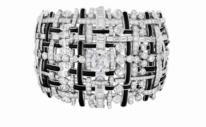 Intricate diamond-studded bracelet with a complex woven design.