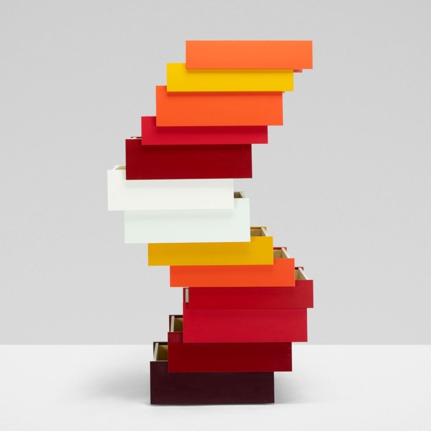 Colorful stack of rectangular panels arranged in a zigzag pattern against a plain background.