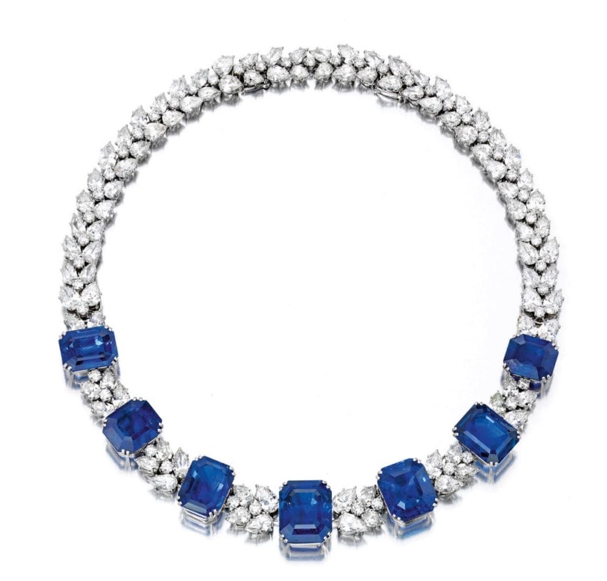 Sapphire and diamond necklace with alternating blue stones and white diamonds arranged in an elegant pattern.