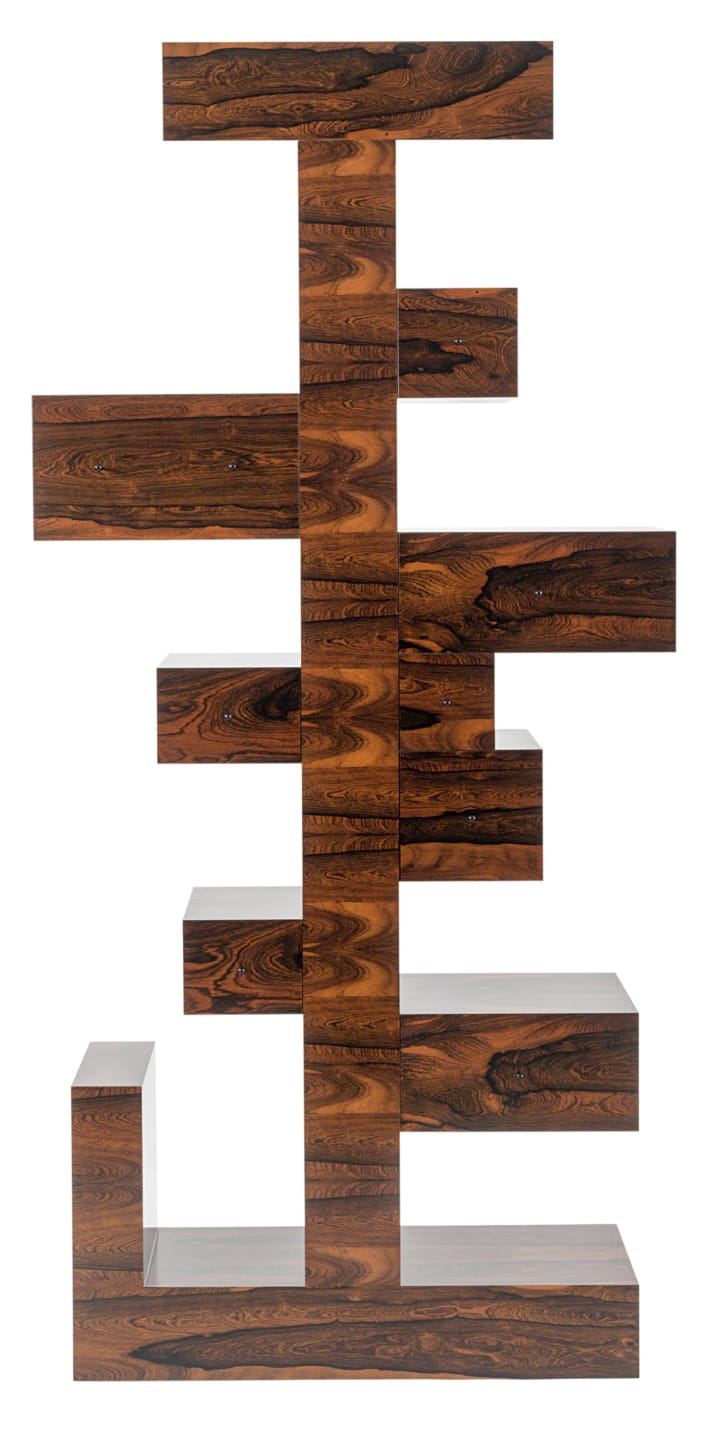 Modern wooden bookshelf with an abstract design and multiple shelves arranged in a unique vertical structure.