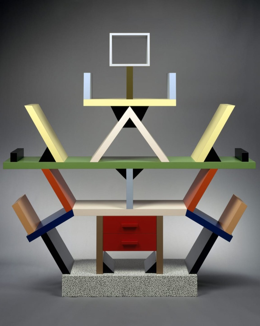 Colorful, abstract furniture piece with geometric shapes and vibrant patterns on a gray background.