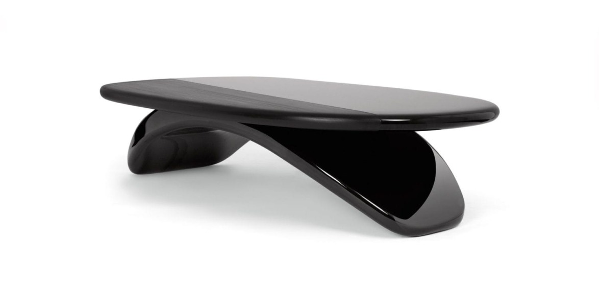 Exquisitely finished with multiple coats of shiny and matte lacquer, the voluptuous Taman coffee table stands 15.7 inches high, 39 inches wide, and 63 inches long.