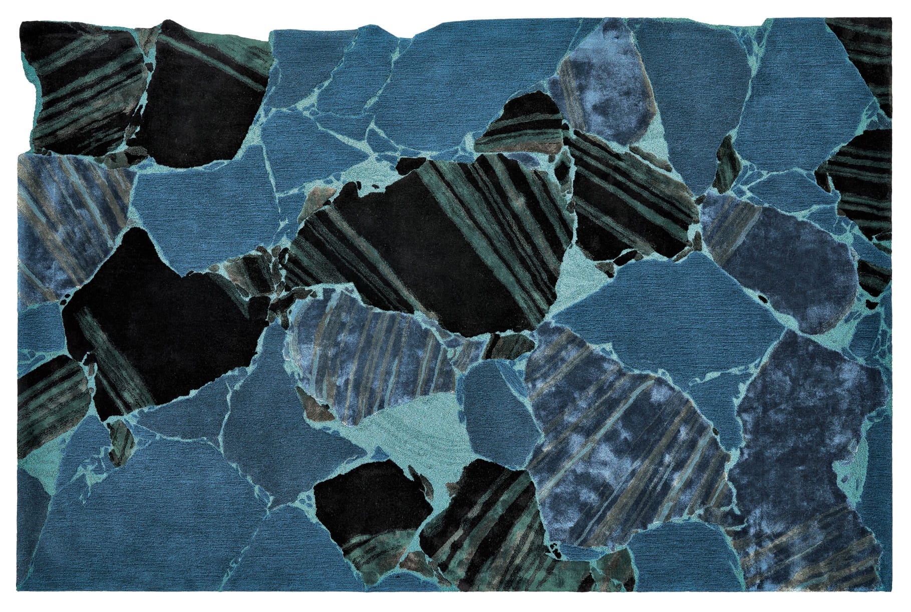 Abstract blue and black geometric pattern resembling unevenly cut stone slabs with varying textures and shades.