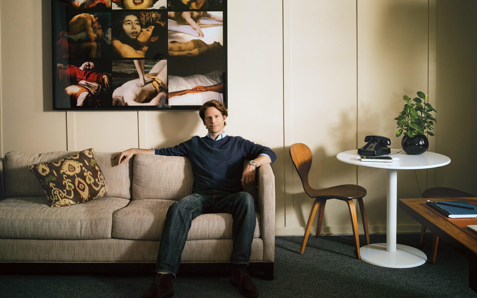 Art collector Trevor Traina in his San Francisco office with Nan Goldin's Crazy Scary (2011).