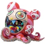 Colorful abstract sculpture featuring a bear-like creature with vibrant eyes, sharp teeth, and octopus tentacles.