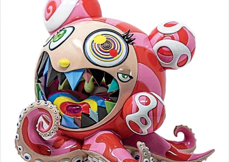 Colorful abstract sculpture featuring a bear-like creature with vibrant eyes, sharp teeth, and octopus tentacles.