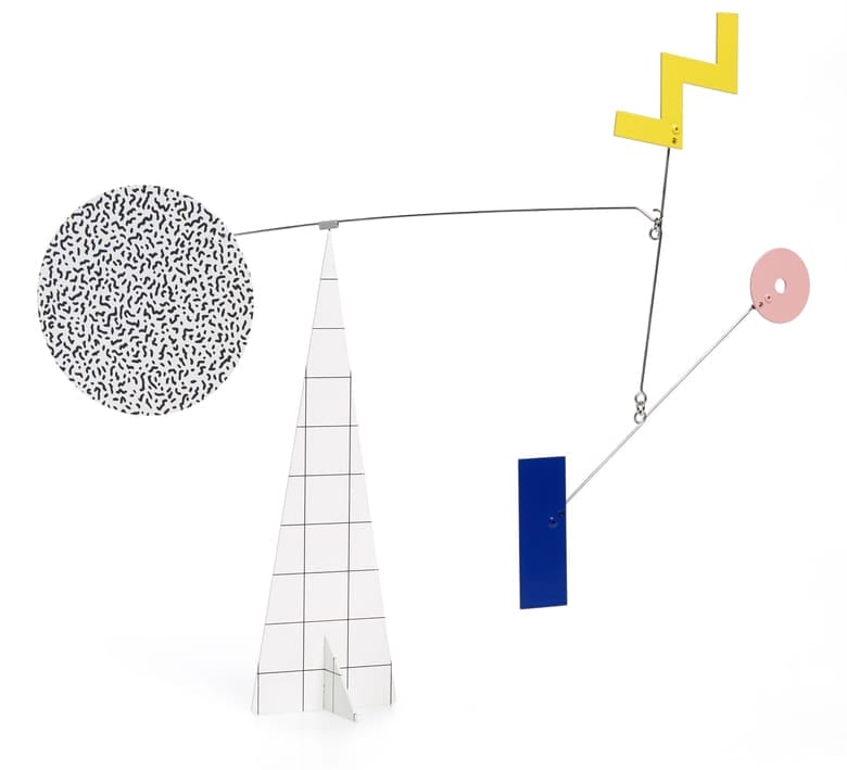 Abstract geometric mobile sculpture with colorful shapes and patterns, including a checkered cone and speckled circle.