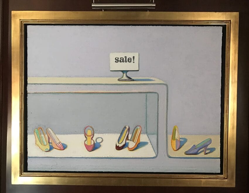 Painting of colorful high heels on display with a "sale!" sign above, framed in gold.