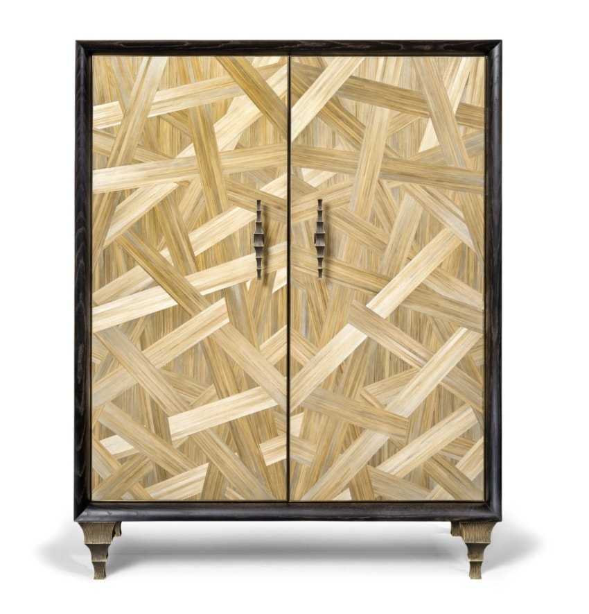 Wooden cabinet with intricate light and dark wood grain pattern, featuring two doors and metallic handles.
