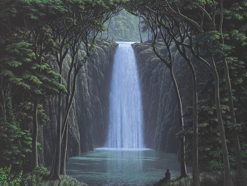 Serene waterfall cascading into a tranquil pool surrounded by lush forest and a person sitting on the edge.