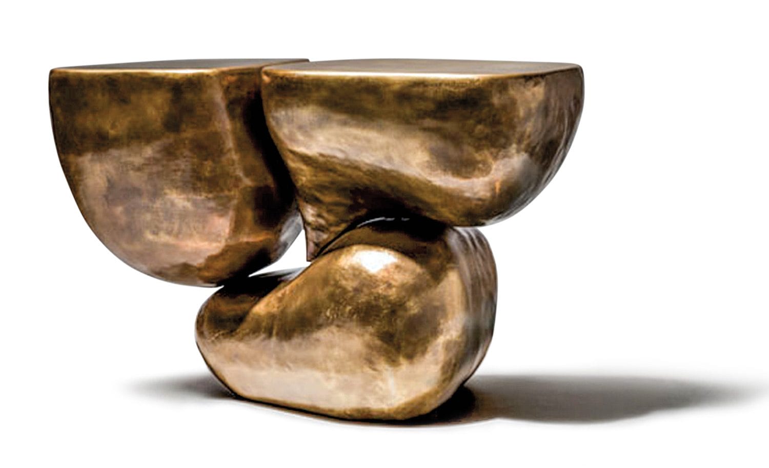 Abstract bronze sculpture with smooth, curved surfaces, composed of balanced organic shapes.