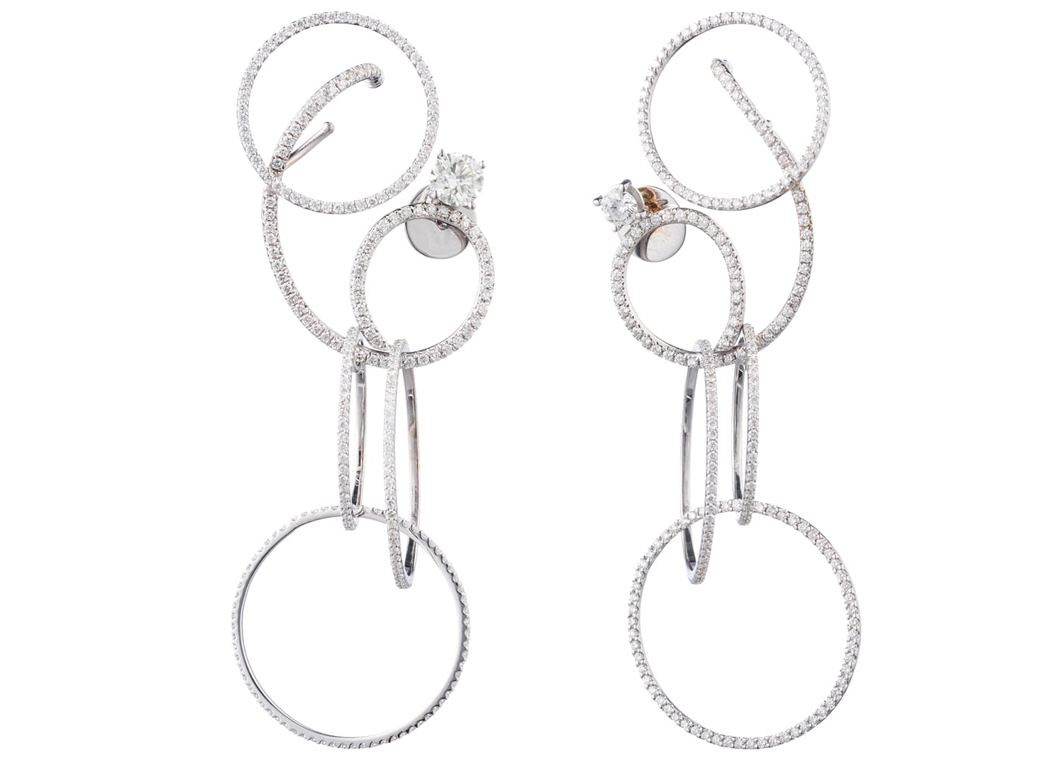 Elegant silver earrings with interlocking circles and sparkling gemstones.