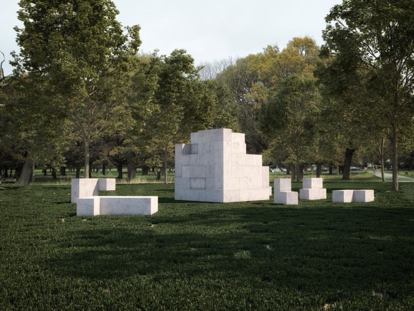 Modern white sculpture surrounded by green trees and grass in a park setting on a clear day.
