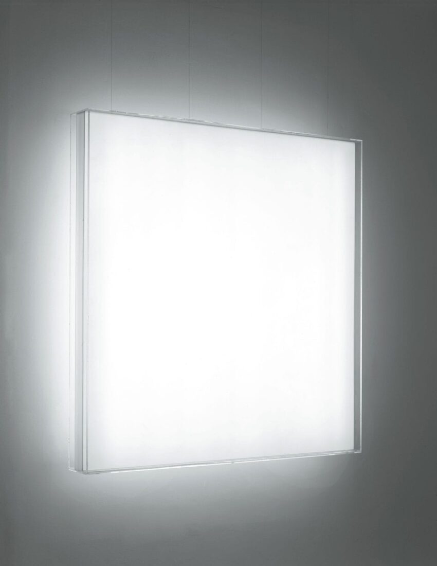 Illuminated rectangular white light box on a wall in a minimalistic setting