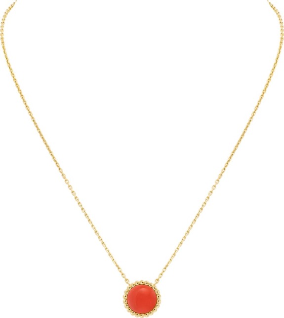 Gold chain necklace featuring a circular red gemstone pendant in a delicate setting.