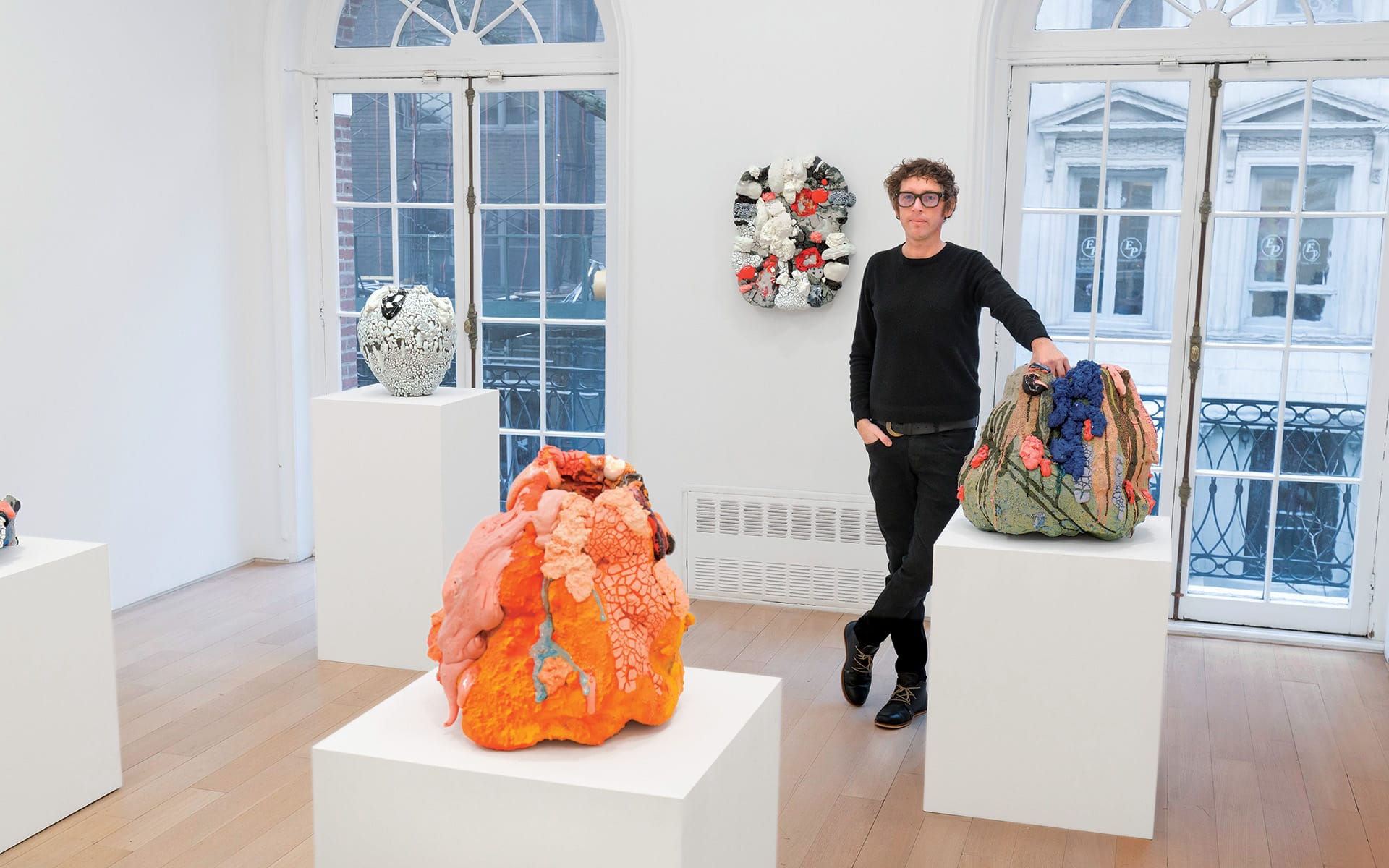 Brian Rochefort with a series of his untitled “Craters” and wall works.