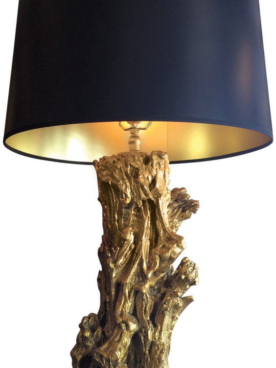 Gold textured table lamp base with large black lampshade, resembling driftwood design.