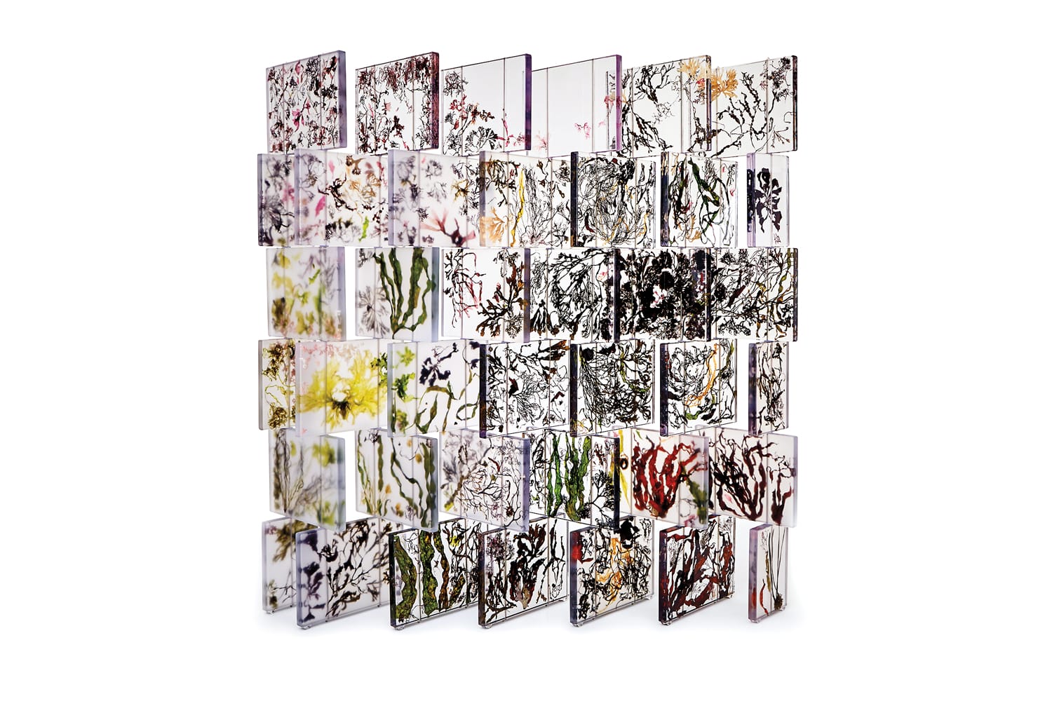 Rows of abstract floral acrylic panels forming a vibrant vertical display with various colors and intricate patterns.