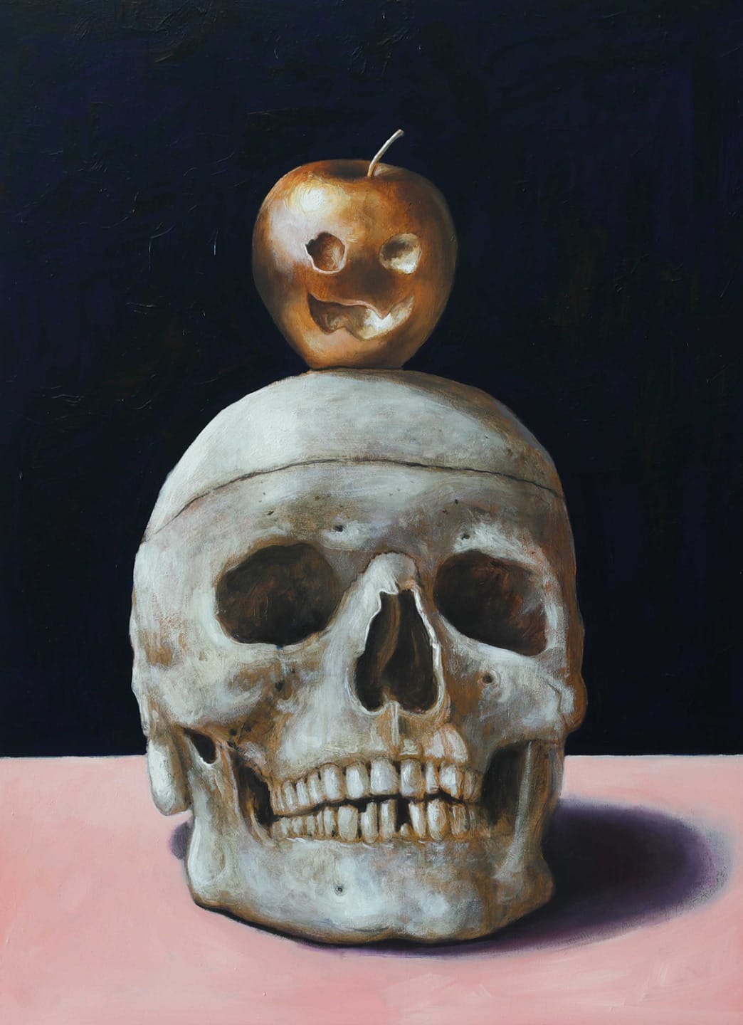 Painting of a human skull with a carved Halloween apple on top, set against a dark background on a pink surface.