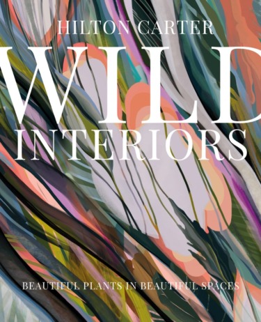 Book cover for "Wild Interiors" by Hilton Carter featuring abstract plant artwork and subtitle "Beautiful Plants in Beautiful Spaces".