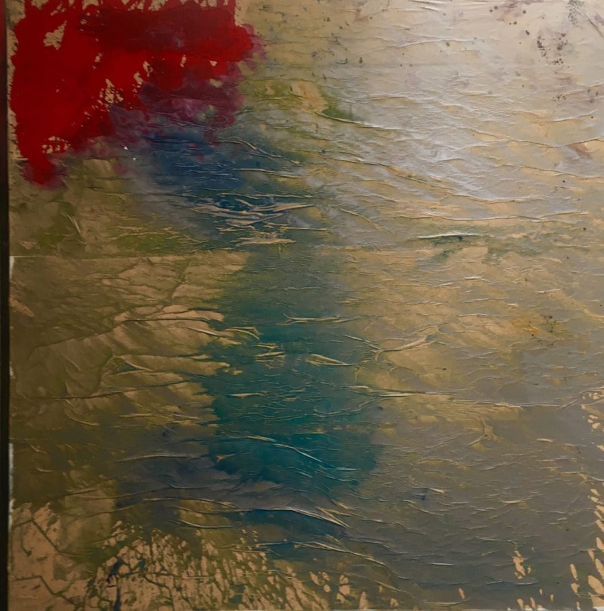 Abstract painting with textured layers of red, blue, and earthy tones creating a dynamic and colorful composition.