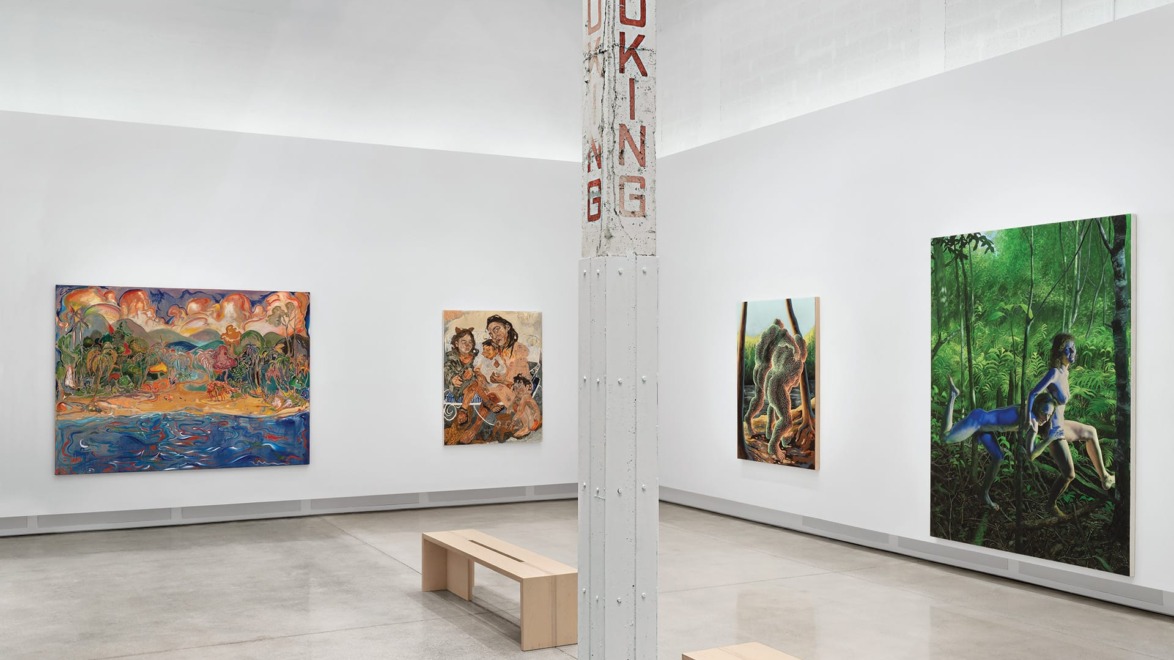 Contemporary art gallery with colorful paintings, featuring benches and a central column with "NO SMOKING" signage.
