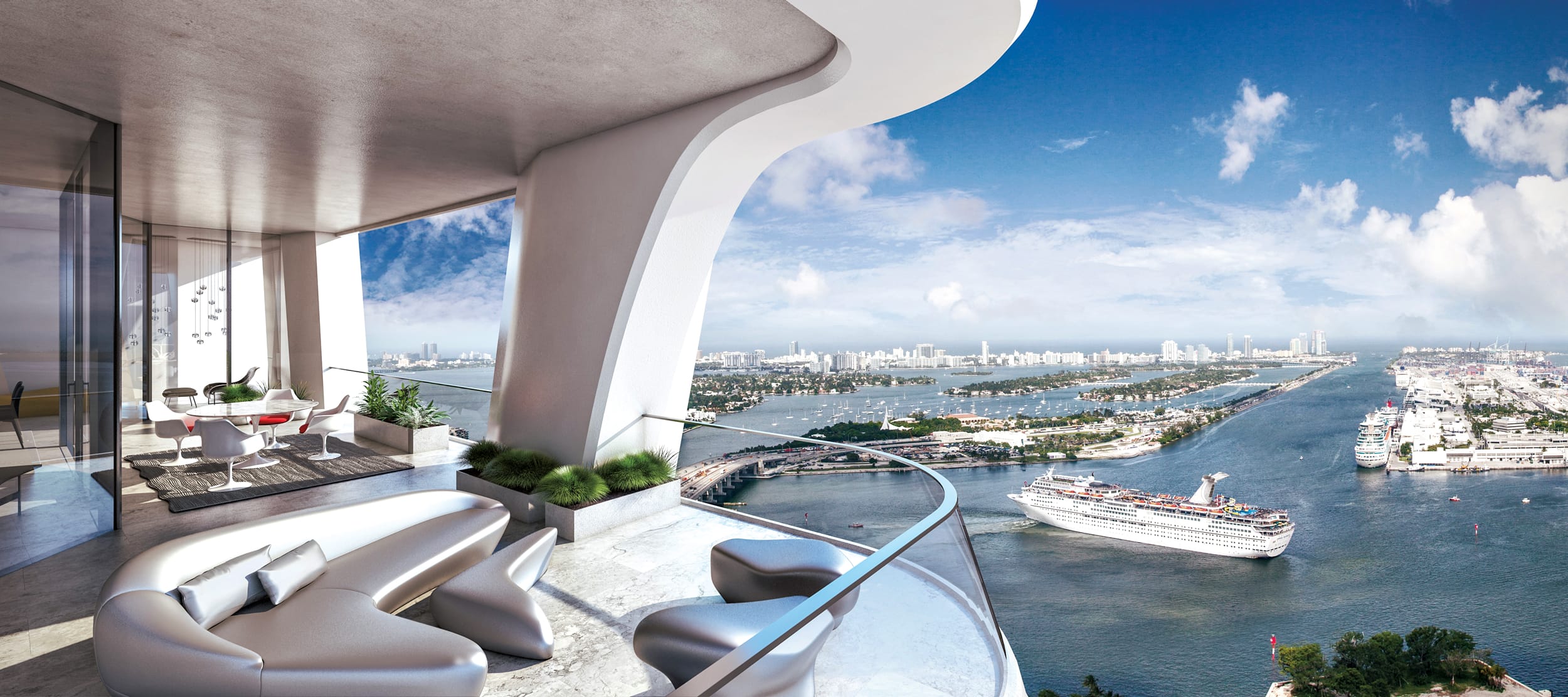 Balcony view from luxury apartment overlooking water with a cruise ship, city skyline, and blue sky in the background.