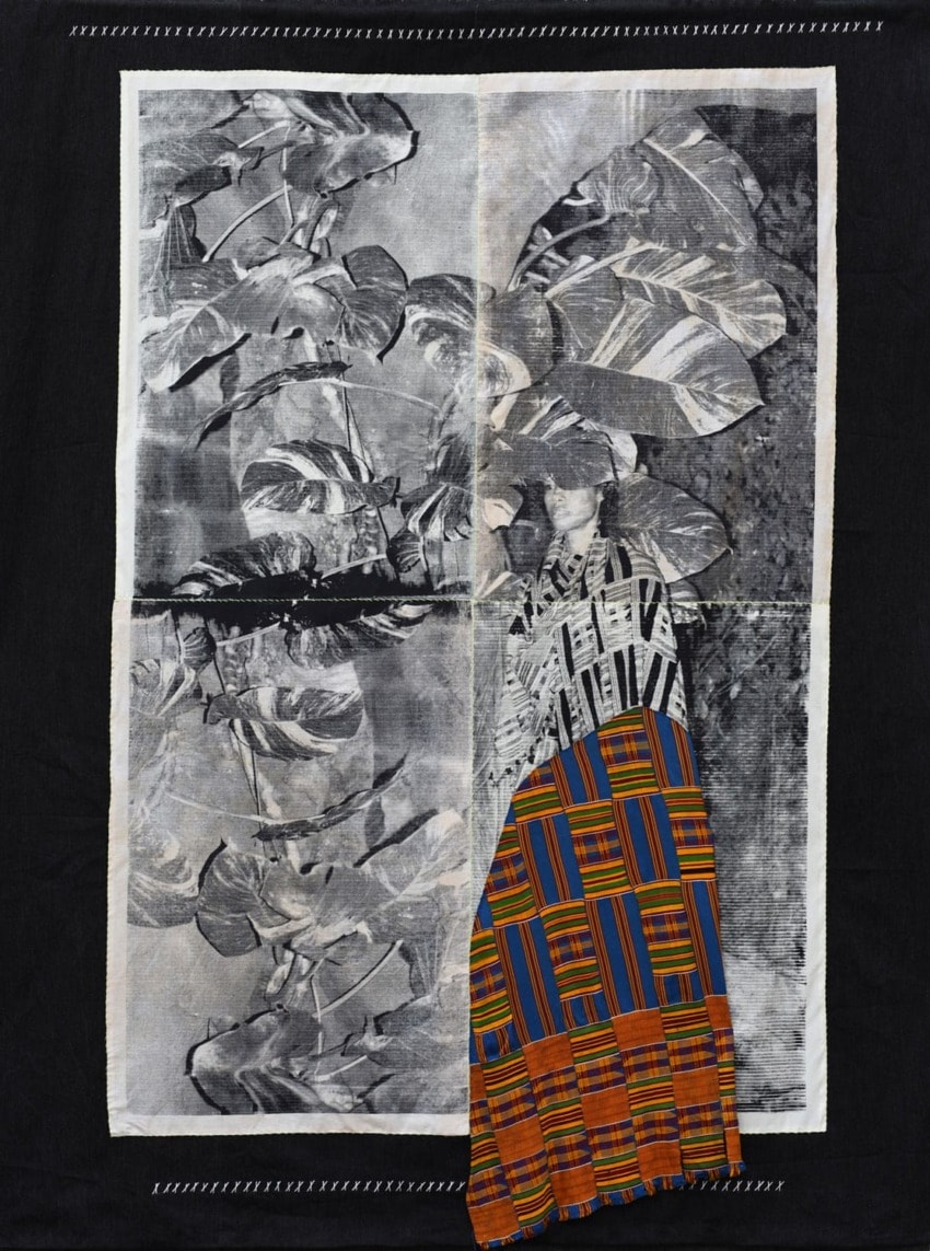 Artwork featuring black and white banana leaves with colorful patterned fabric on a black background.